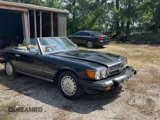 ✅ 1986 Mercedes-Benz 560 SL • VIN: WDBBA48D1GA049764 • Lot: 63930745. Listed on Copart with 123,527 mi. Free auction sales archive from the USA and detailed vehicle history report at DreamBid. Image 1.
