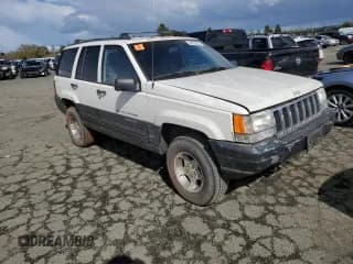 ✅ 1997 Jeep Grand Cherokee Laredo • VIN: 1J4GZ58S8VC647415 • Лот: 49258934. Опубликован ранее на Copart с пробегом Не указан. Бесплатный доступ к архиву аукционных продаж из США и подробный отчёт об истории автомобиля на DreamBid. Изображение 4.