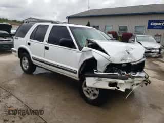 1999 Chevrolet Blazer LS z VIN 1GNDT13W9X2166733, wystawiony jako Copart lot #64965434 z przebiegiem 214 296 mil mil oraz Nie do naprawy • Non repairable. Historia ofert i sprzedaży dostępna na DreamBid. Obrazek 4.