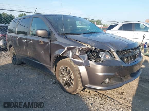 2018 Dodge Grand Caravan SXT z VIN 2C4RDGCG8JR159899, wystawiony jako IAAI lot #42837233 z przebiegiem 104 074 mil mil oraz . Historia ofert i sprzedaży dostępna na DreamBid. Obrazek 1.