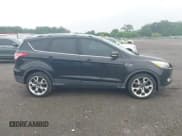 ✅ 2015 Ford Escape Titanium • VIN: 1FMCU0JX7FUB00462 • Lot: 42532943. Listed on IAAI with 88,623 mi. Free auction sales archive from the USA and detailed vehicle history report at DreamBid. Image 13.