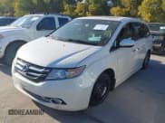 ✅ 2015 Honda Odyssey Touring Elite • VIN: 5FNRL5H96FB060244 • Lot: 43701520. Listed on IAAI with 185,250 mi. Free auction sales archive from the USA and detailed vehicle history report at DreamBid. Image 2.