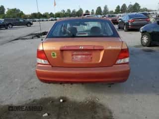2000 Hyundai Accent z VIN KMHCG35G7YU033965, wystawiony jako Copart lot #82433065 z przebiegiem 111 729 mil mil oraz Szkoda całkowita • Salvage title. Historia ofert i sprzedaży dostępna na DreamBid. Obrazek 6.