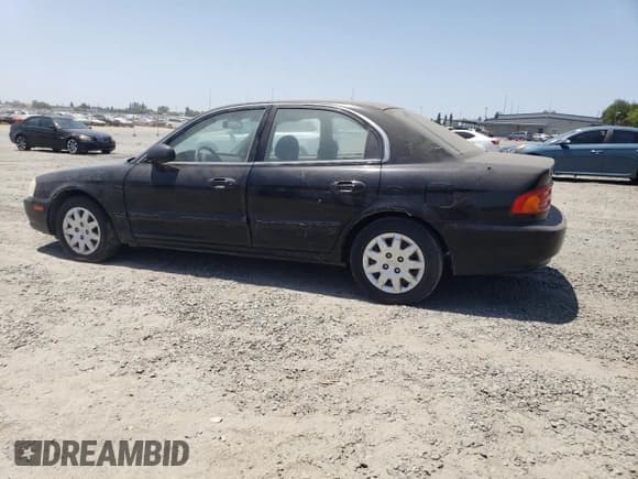 ✅ 2002 Kia Optima LX • VIN: KNAGD126225129497 • Лот: 61109505. Опубликован ранее на Copart с пробегом 148 848 миль. Бесплатный доступ к архиву аукционных продаж из США и подробный отчёт об истории автомобиля на DreamBid. Изображение 2.