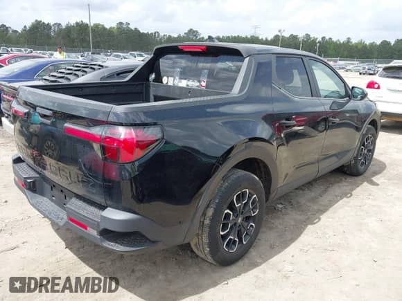 2022 Hyundai Santa Cruz SE with VIN 5NTJA4AE6NH003287, listed as a IAAI auction lot 41957238 with 39,113 mi miles and . Bid and sale history available at DreamBid. Image 4.