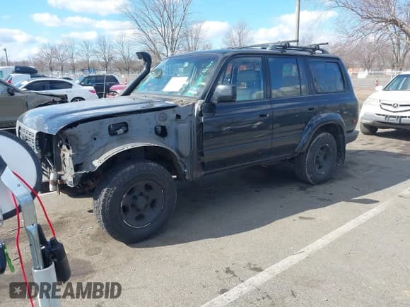 ✅ 1997 Toyota Land Cruiser • VIN: JT3HJ85J7V0179374 • Lot: 41690214. Listed on IAAI with 216,418 mi. Free auction sales archive from the USA and detailed vehicle history report at DreamBid. Image 2.