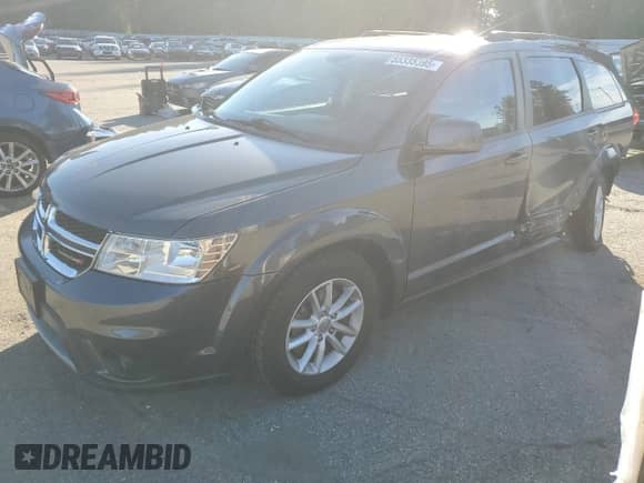 2015 Dodge Journey SXT with VIN 3C4PDCBB1FT698097, listed as a Copart auction lot 85335395 with 103,167 mi miles and Salvage title. Bid and sale history available at DreamBid. Image 1.