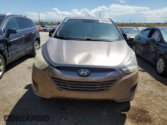 2011 Hyundai Tucson GL z VIN KM8JT3AB7BU200443, wystawiony jako Copart lot #69025884 z przebiegiem 186 588 mil mil oraz Czysty tytuł • Clean title. Historia ofert i sprzedaży dostępna na DreamBid. Obrazek 5.