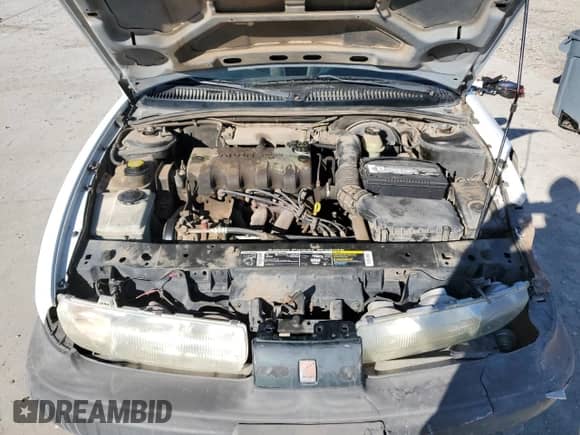 1998 Saturn SL z VIN 1G8ZF5287WZ120978, wystawiony jako Copart lot #43070995 z przebiegiem 279 889 mil mil oraz Szkoda całkowita • Salvage title. Historia ofert i sprzedaży dostępna na DreamBid. Obrazek 13.