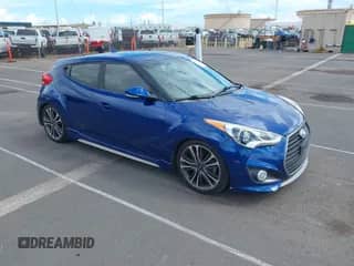2016 Hyundai Veloster Turbo z VIN KMHTC6AE6GU295721, wystawiony jako IAAI lot #43409419 z przebiegiem 103 962 mil mil oraz . Historia ofert i sprzedaży dostępna na DreamBid. Obrazek 1.