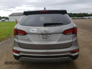 ✅ 2018 Hyundai Santa Fe Limited • VIN: 5XYZUDLA4JG549784 • Лот: 70005283. Опубликован ранее на Copart с пробегом 47 686 миль. Бесплатный доступ к архиву аукционных продаж из США и подробный отчёт об истории автомобиля на DreamBid. Изображение 6.