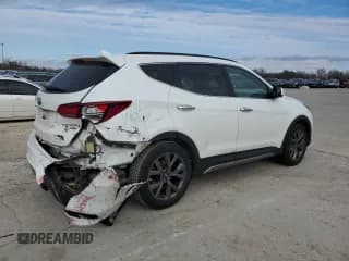 ✅ 2017 Hyundai Santa Fe Ultimate • VIN: 5XYZW4LAXHG495685 • Лот: 82484263. Опубликован ранее на Copart с пробегом 99 589 миль. Бесплатный доступ к архиву аукционных продаж из США и подробный отчёт об истории автомобиля на DreamBid. Изображение 3.