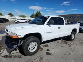 2000 Dodge Dakota Sport z VIN 1B7GG22N9YS703983, wystawiony jako Copart lot #80115605 z przebiegiem 92 996 mil mil oraz Szkoda całkowita • Salvage title. Historia ofert i sprzedaży dostępna na DreamBid. Obrazek 1.