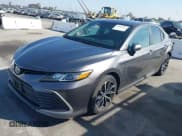 ✅ 2021 Toyota Camry Hybrid LE • VIN: 4T1C31AK8MU548512 • Lot: 43508019. Listed on IAAI with 56,771 mi. Free auction sales archive from the USA and detailed vehicle history report at DreamBid. Image 17.