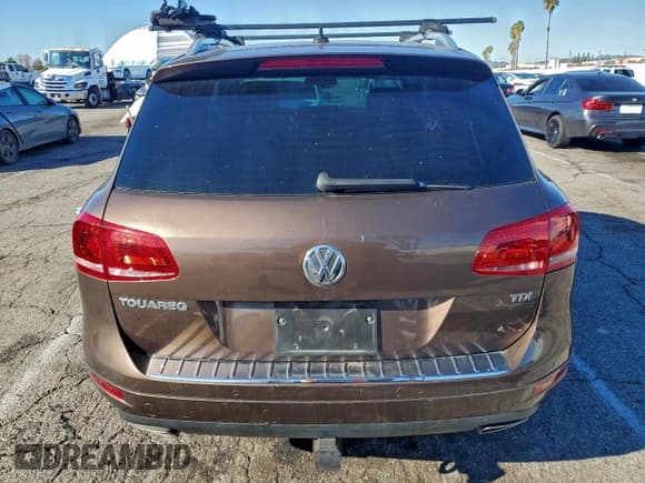 ✅ 2014 Volkswagen Touareg Exec • VIN: WVGEP9BP4ED004709 • Лот: 94182655. Опубликован ранее на Copart с пробегом Не указан. Бесплатный доступ к архиву аукционных продаж из США и подробный отчёт об истории автомобиля на DreamBid. Изображение 6.