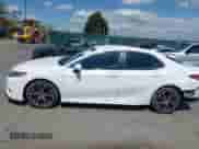 2019 Toyota Camry LE z VIN 4T1B11HK0KU754797, wystawiony jako IAAI lot #42032914 z przebiegiem 93 862 mil mil oraz . Historia ofert i sprzedaży dostępna na DreamBid. Obrazek 14.