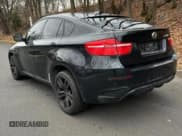 ✅ 2011 BMW X6 M • VIN: 5YMGZ0C5XBLK13932 • Лот: 41661715. Опубликован ранее на Copart с пробегом 113 047 миль. Бесплатный доступ к архиву аукционных продаж из США и подробный отчёт об истории автомобиля на DreamBid. Изображение 3.