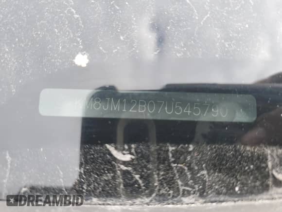 2007 Hyundai Tucson GLS z VIN KM8JM12B07U545790, wystawiony jako Copart lot #80977684 z przebiegiem 249 471 mil mil oraz Szkoda całkowita • Salvage title. Historia ofert i sprzedaży dostępna na DreamBid. Obrazek 13.