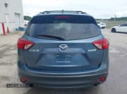 ✅ 2015 Mazda CX-5 Grand Touring • VIN: JM3KE2DY9F0536953 • Lot: 42709042. Wystawiony na IAAI z przebiegiem 129 160 mil. Bezpłatny archiwum sprzedaży aukcyjnych z USA i szczegółowy raport historii pojazdu na DreamBid. Zdjęcie 16.