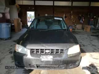 2000 Hyundai Accent z VIN KMHCG45G9YU127156, wystawiony jako Copart lot #63414815 z przebiegiem 91 446 mil mil oraz Czysty tytuł • Clean title. Historia ofert i sprzedaży dostępna na DreamBid. Obrazek 5.