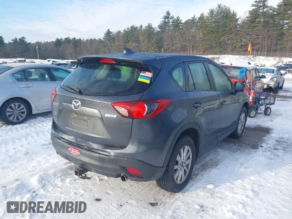 ✅ 2014 Mazda CX-5 Sport • VIN: JM3KE2BEXE0398881 • Lot: 43848471. Listed on IAAI with 173,392 mi. Free auction sales archive from the USA and detailed vehicle history report at DreamBid. Image 4.