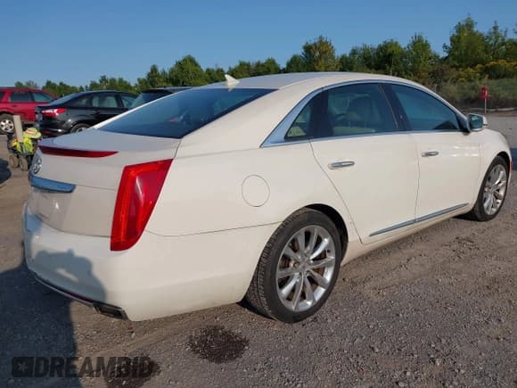 ✅ 2014 Cadillac XTS Luxury • VIN: 2G61M5S38E9131433 • Lot: 43151702. Listed on IAAI with 177,051 mi. Free auction sales archive from the USA and detailed vehicle history report at DreamBid. Image 4.