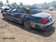 ✅ 1999 Lincoln Town Car Cartier • VIN: 1LNHM83W0XY673738 • Lot: 42437877. Listed on IAAI with 143,018 mi. Free auction sales archive from the USA and detailed vehicle history report at DreamBid. Image 3.