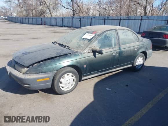 1998 Saturn SL z VIN 1G8ZF5287WZ294842, wystawiony jako IAAI lot #41726012 z przebiegiem 170 385 mil mil oraz . Historia ofert i sprzedaży dostępna na DreamBid. Obrazek 2.