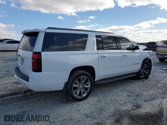 ✅ 2020 Chevrolet Suburban LT • VIN: 1GNSKHKC0LR173727 • Lot: 91106325. Listed on Copart with 111,503 mi. Free auction sales archive from the USA and detailed vehicle history report at DreamBid. Image 3.