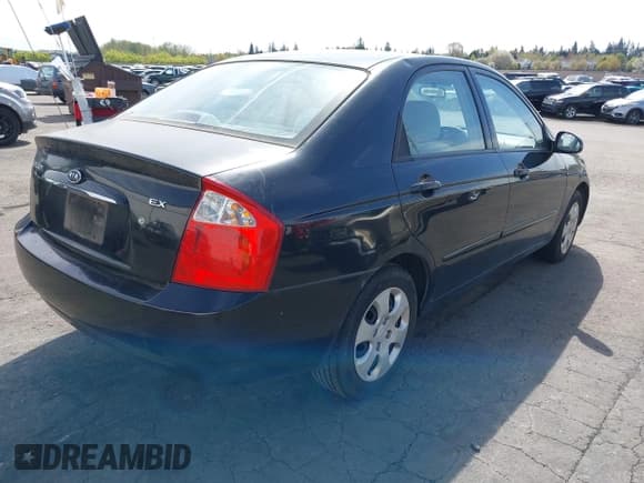 ✅ 2006 Kia Spectra EX • VIN: KNAFE122965304811 • Lot: 41998981. Listed on IAAI with 184,119 mi. Free auction sales archive from the USA and detailed vehicle history report at DreamBid. Image 4.