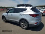 ✅ 2018 Hyundai Santa Fe 2.4L • VIN: 5XYZT3LBXJG569799 • Лот: 60612254. Опубликован ранее на Copart с пробегом 94 415 миль. Бесплатный доступ к архиву аукционных продаж из США и подробный отчёт об истории автомобиля на DreamBid. Изображение 2.