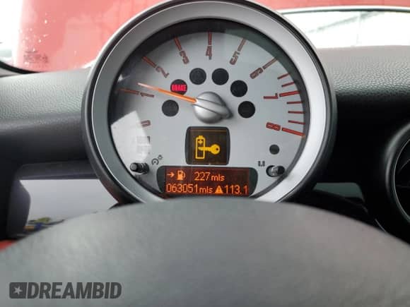 2009 MINI Hardtop with VIN WMWMF33559TU70753, listed as a Copart auction lot 79898174 with 63,051 mi miles and Salvage title. Bid and sale history available at DreamBid. Image 9.