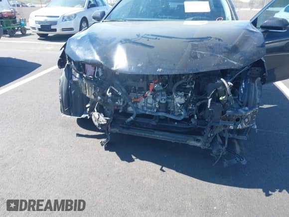 2022 Toyota Camry Hybrid XLE with VIN 4T1F31AK5NU594457, listed as a IAAI auction lot 41884438 with 69,767 mi miles and . Bid and sale history available at DreamBid. Image 6.