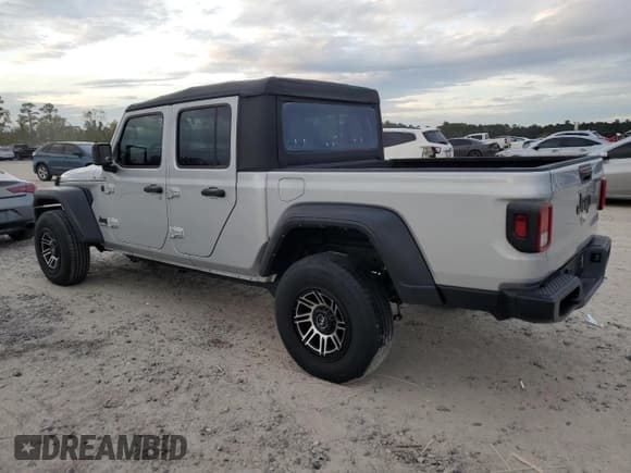✅ 2022 Jeep Gladiator Sport • VIN: 1C6HJTAG1NL110162 • Лот: 82398914. Опубликован ранее на Copart с пробегом Не указан. Бесплатный доступ к архиву аукционных продаж из США и подробный отчёт об истории автомобиля на DreamBid. Изображение 2.
