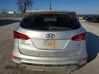 ✅ 2018 Hyundai Santa Fe 2.4L • VIN: 5XYZTDLBXJG550983 • Лот: 82901933. Опубликован ранее на Copart с пробегом 105 121 миль. Бесплатный доступ к архиву аукционных продаж из США и подробный отчёт об истории автомобиля на DreamBid. Изображение 6.