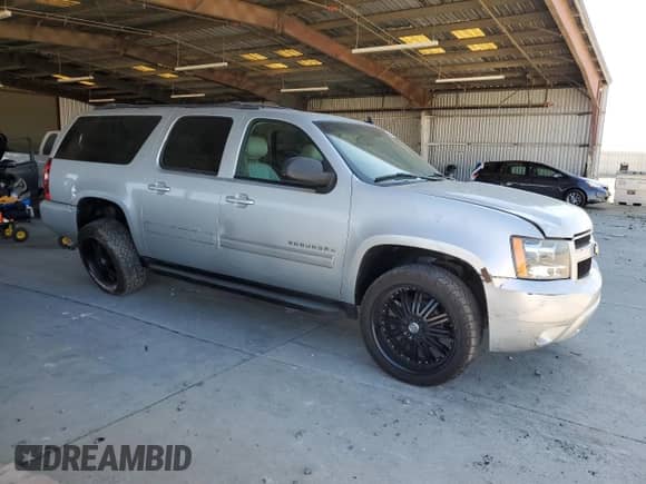 2013 Chevrolet Suburban LT with VIN 1GNSKJE79DR213312, listed as a Copart auction lot 70356745 with 79,474 mi miles and Salvage title. Bid and sale history available at DreamBid. Image 4.
