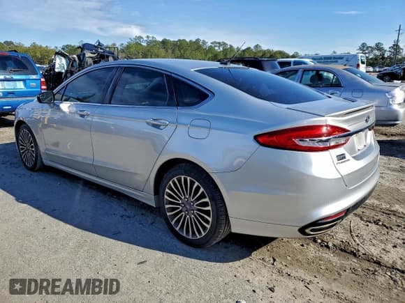 ✅ 2017 Ford Fusion Titanium • VIN: 3FA6P0K94HR401974 • Lot: 96107145. Listed on Copart with 143,236 mi. Free auction sales archive from the USA and detailed vehicle history report at DreamBid. Image 2.
