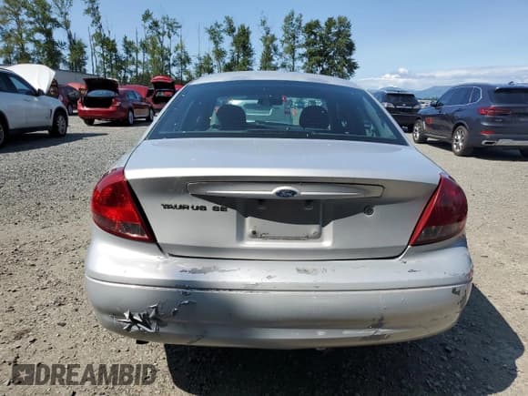 ✅ 2005 Ford Taurus SE • VIN: 1FAFP53U05A259841 • Lot: 57255835. Listed on Copart with 179,821 mi. Free auction sales archive from the USA and detailed vehicle history report at DreamBid. Image 6.