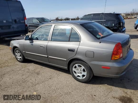 2005 Hyundai Accent GLS z VIN KMHCG45C65U625887, wystawiony jako Copart lot #48824225 z przebiegiem 110 594 mil mil oraz Szkoda całkowita • Salvage title. Historia ofert i sprzedaży dostępna na DreamBid. Obrazek 2.