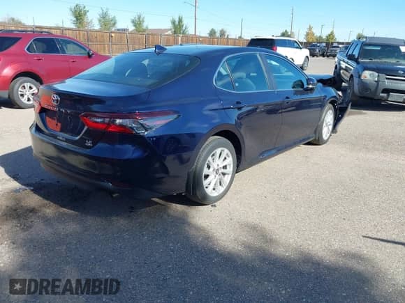 2021 Toyota Camry LE with VIN 4T1C11BK9MU035127, listed as a IAAI auction lot 43239092 with 21,677 mi miles and . Bid and sale history available at DreamBid. Image 4.