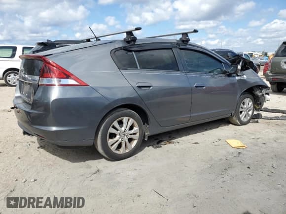 ✅ 2013 Honda Insight EX • VIN: JHMZE2H70DS006430 • Лот: 72613174. Опубликован ранее на Copart с пробегом Не указан. Бесплатный доступ к архиву аукционных продаж из США и подробный отчёт об истории автомобиля на DreamBid. Изображение 3.