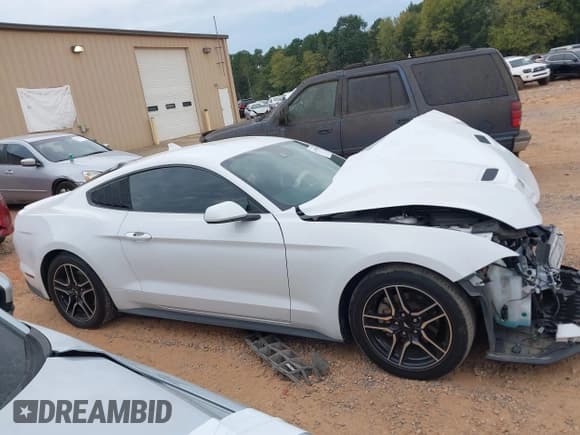 ✅ 2021 Ford Mustang EcoBoost • VIN: 1FA6P8TH9M5101140 • Lot: 43309485. Listed on IAAI with 69,861 mi. Free auction sales archive from the USA and detailed vehicle history report at DreamBid. Image 13.
