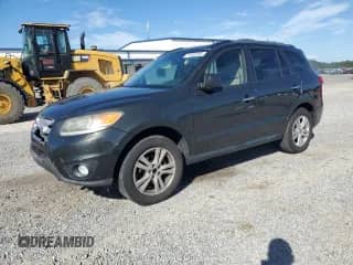 2012 Hyundai Santa Fe Limited с VIN 5XYZKDAG0CG126815, выставлен на аукционе Copart как лот 71302305 с пробегом 210 716 миль миль и Списание • Salvage title. История ставок и продаж доступна на DreamBid. Изображение 1.