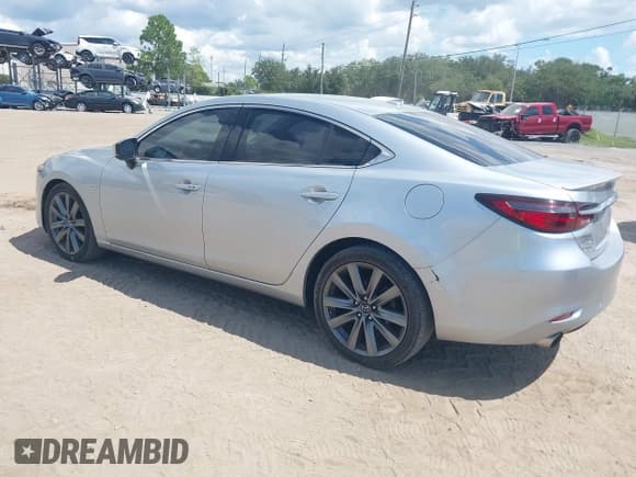 ✅ 2018 Mazda 6 Grand Touring • VIN: JM1GL1TY4J1318311 • Lot: 43240836. Listed on IAAI with 101,987 mi. Free auction sales archive from the USA and detailed vehicle history report at DreamBid. Image 3.