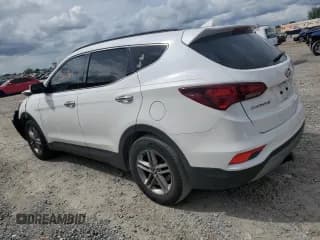 ✅ 2018 Hyundai Santa Fe 2.4L • VIN: 5NMZUDLB4JH104458 • Лот: 70008413. Опубликован ранее на Copart с пробегом 56 961 миль. Бесплатный доступ к архиву аукционных продаж из США и подробный отчёт об истории автомобиля на DreamBid. Изображение 2.
