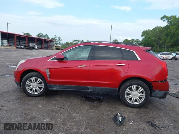 ✅ 2012 Cadillac SRX • VIN: 3GYFNGE30CS630633 • Lot: 42649900. Listed on IAAI with 141,946 mi. Free auction sales archive from the USA and detailed vehicle history report at DreamBid. Image 14.
