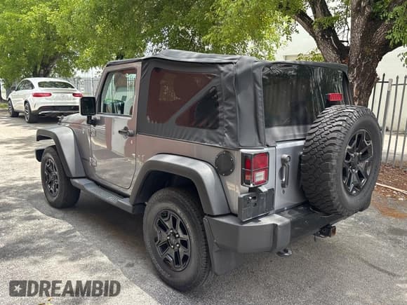 ✅ 2016 Jeep Wrangler Sport • VIN: 1C4AJWAGXGL117724 • Lot: 59418365. Listed on Copart with 122,337 mi. Free auction sales archive from the USA and detailed vehicle history report at DreamBid. Image 3.
