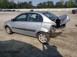 ✅ 2006 Kia Rio • VIN: KNADE123666145384 • Lot: 67532454. Listed on Copart with 122,832 mi. Free auction sales archive from the USA and detailed vehicle history report at DreamBid. Image 2.