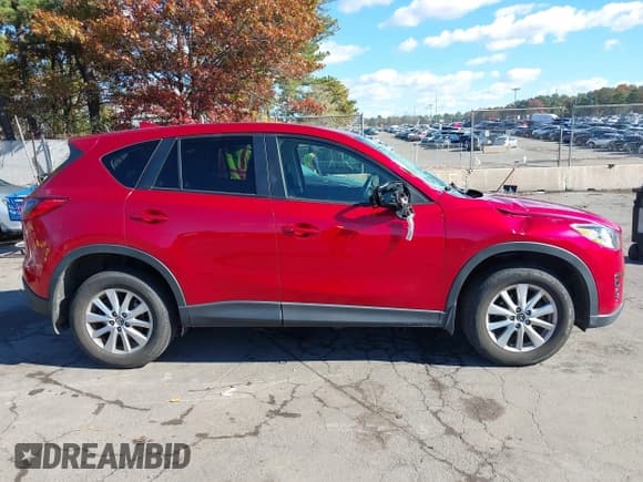 ✅ 2016 Mazda CX-5 Touring • VIN: JM3KE4CY6G0890119 • Lot: 43610292. Wystawiony na IAAI z przebiegiem 119 195 mil. Bezpłatny archiwum sprzedaży aukcyjnych z USA i szczegółowy raport historii pojazdu na DreamBid. Zdjęcie 13.