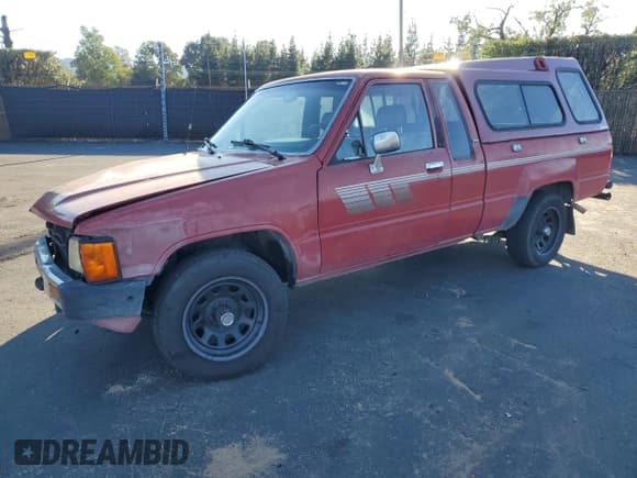 ✅ 1985 Toyota Pickup Deluxe • VIN: JT4RN56D9F0127080 • Lot: 87090105. Listed on Copart with 231,275 mi. Free auction sales archive from the USA and detailed vehicle history report at DreamBid. Image 1.